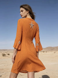 Mid-length dress embroidered with starfish, Liberty print